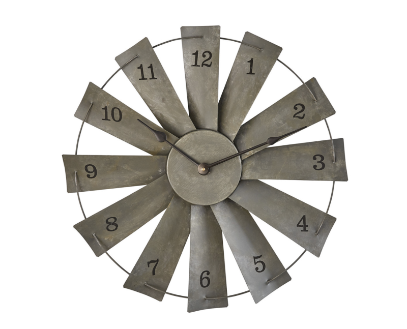 A rustic metal windmill clock with numbers on it, perfect for farmhouse decor. Available at Sams Shoppe.